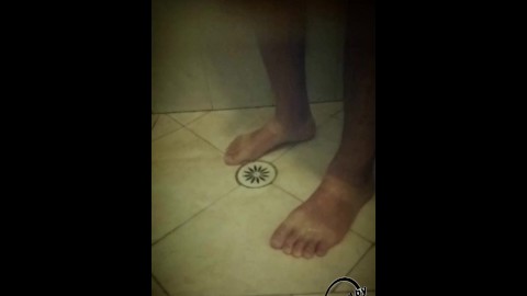 Soapy shower feet and rubbing one down - peephole view