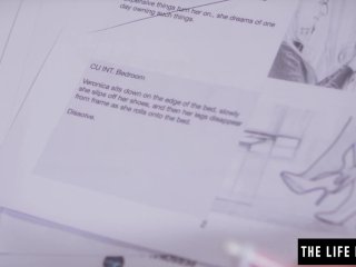 Shaved beauty pushes a big black dildo inside