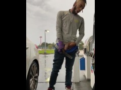 SMOKEPOLEBOY JACKING BIG BLACK COCK AT GAS STATION DURING RAINY DAY.