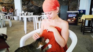 Bethany gets a massage from a cat in public