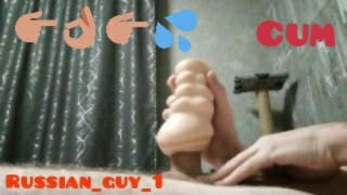Guy fingering his dick with a rubber vagina