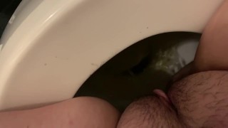 Teen girl peeing in toilet 