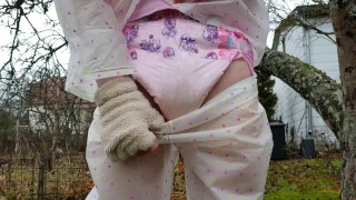 Diaper Wetting In The Outdoors With Transparent Rainwear
