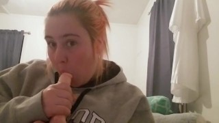 College girl sucks on dildo