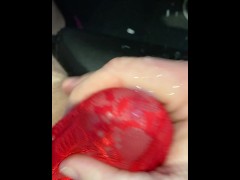 Big watery cum shot through red mesh thong whilst watching porn