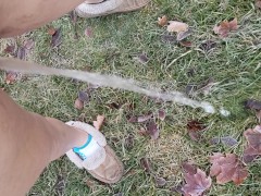 Girl Standing Pee Outside In Grass