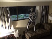 Preview 2 of zentai skeleton jerk off at hotel room window and then room door