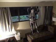 Preview 3 of zentai skeleton jerk off at hotel room window and then room door