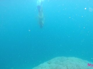 Girl with a perfect butt and tits swimming at open sea Maldives