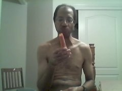 BLACK GAY STICKS CARROT IN ASS AND EATS IT