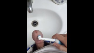 Massage the penis with a Electric toothbrush