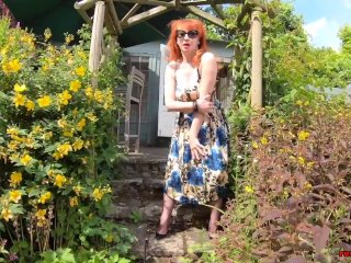 Busty babe Red XXX fingers herself in the garden
