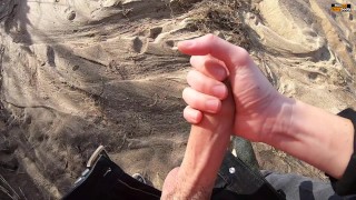 A RISKY QUICK HANDJOB AT A PUBLIC BEACH IS GIVEN BY A GIRLFRIEND