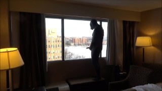 wetsuited masked horny guy comes onto hotel room window