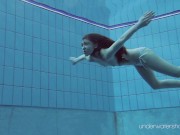 Roxalana submerged in the pool naked