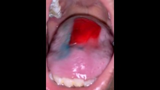 Teen girl eating candy mouth up close pov 