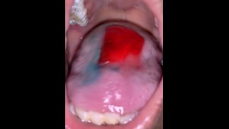 Teen girl eating candy mouth up close pov 