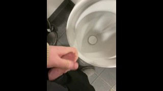 Having a risky wank in public toilets 