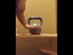 Wife crushes balls with kettle bells