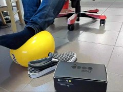 Male Shoeplay with beach ball in Under Armor, Vans Slip Ons, Black Socks