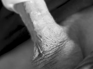 fleshlight handjob and cumshot.Male blowjob toy close up. Black and white