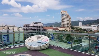 Girl with red hair sunbathes without panties by the pool