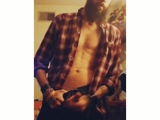 Bearded muscular guy jerking off cums and eats it