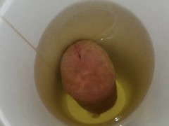 pissing in a cup from the bottom and letting it drip down my balls