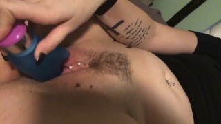Pierced girl plays with pussy