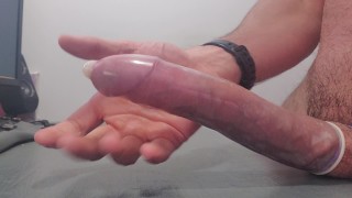 Multiple Cumshots In A Condom Tied Together With Some Ball Torture Fun For All