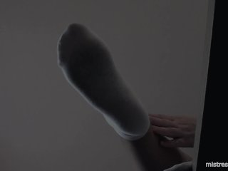 Legs in white socks on the table