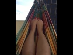 @tici_feet ig tici_feet rubbing my feet in my hammock, red toenails