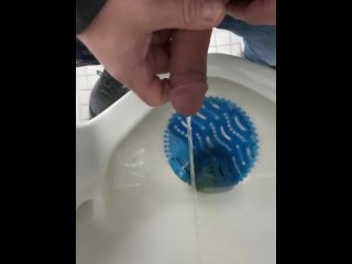 Pissing at a urinal. 