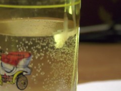 Russian cock cums in a glass and sperm blobs drowns in water; english text