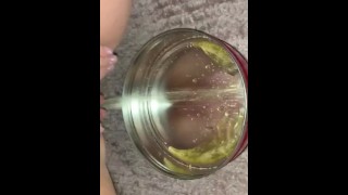 Small piss in empty cookie container 