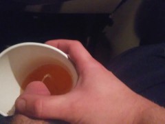 Pissing into a Mc Cup