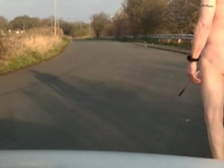 Naked in road with pump on