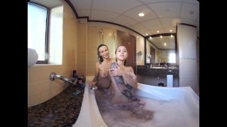Hot busty lesbian lovers taking a steamy bubble bath in this VR video