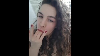 curly brunette making herself squirt with low angle view of ass and pussy