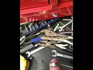 Mechanic plays with his tools