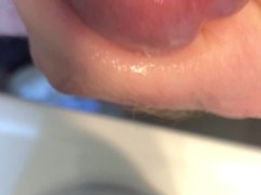 Oiled cock close up with orgasm