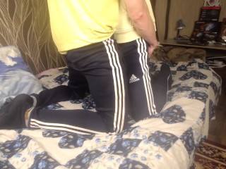 TWO GUYS IN SPORTSWEAR HUGGING