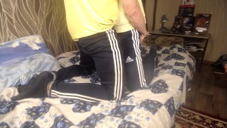 TWO GUYS IN SPORTSWEAR HUGGING