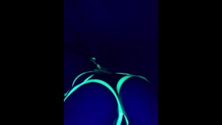 Glowing ebony ass under blacklight