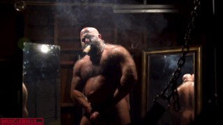 SMOKING HIS CIGAR IN FRONT OF THE SLING BY HYPER MASCULINE MUSCLE HAIRY BULL
