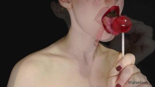 Hot sexy red lips licking and sucking pop and other food