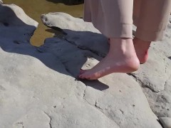  showing her feet on the river