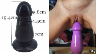 HD clouse-up of a very big purple dildo inside a teen pussy
