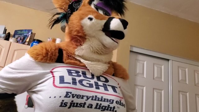 Deer in a fursuit surprises her human boyfriend during a private moment. Explicit, humorous encounter featuring a MILF with big assets.