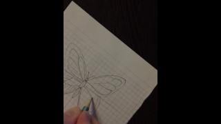 Russian boy drawing a butterfly